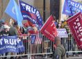 President Donald Turmp supporters gather outside Walter Reed National Military Medical Center in Bethesda, Md., Sunday, Oct. 4, 2020. Trump was admitted to the hospital after contracting COVID-19. (AP Photo/Anthony Peltier)